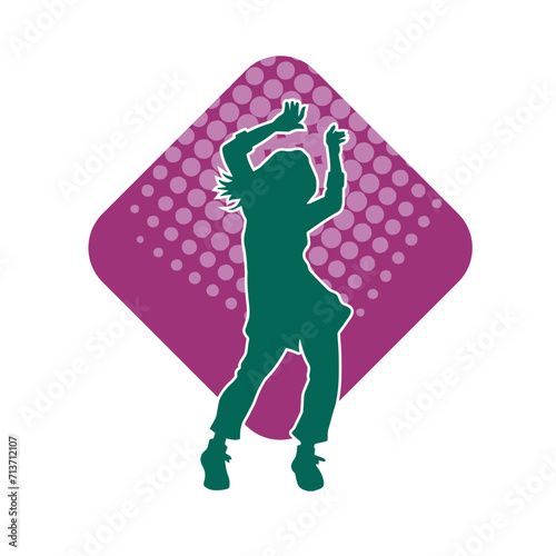 Silhouette of a female dancer in action pose. Silhouette of a woman dancing happily.
