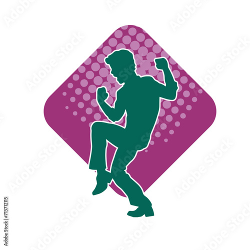 Silhouette of a male dancer in performing pose. Silhouette of a dancing man.