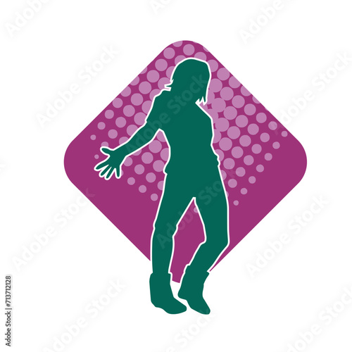 Silhouette of a female dancer in action pose. Silhouette of a woman dancing happily.