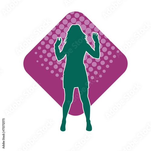 Silhouette of a female dancer in action pose. Silhouette of a woman dancing happily.