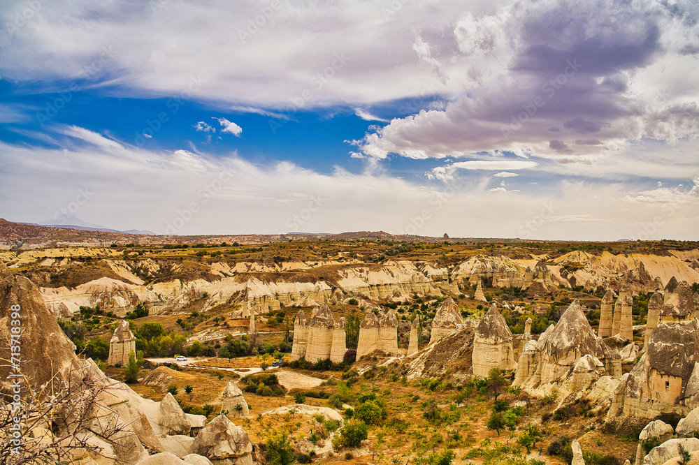 The unique rock caves, fairy chimneys and rock pillars in the Red valley seen from the Panoramic point near Goreme in the Cappadocia Region, Central Anatolia,Turkey.