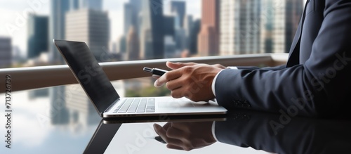 close up of businessman's hand using tablet in office background