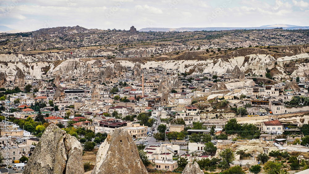 Panoramic view of Goreme town with characteristic cave hotels, unique rock structures and unique landscape  a UNESCO world heritage site  in the Cappadocia Region,Turkey.