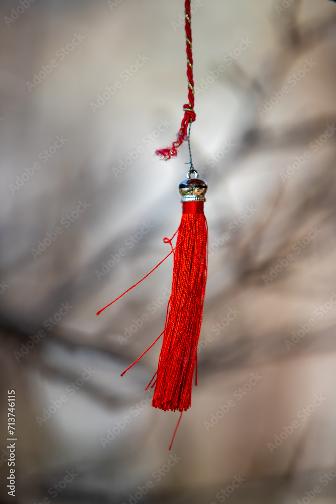 A red Japanese tassel hangs on the outside. A red Japanese tassel hangs on the outside.
