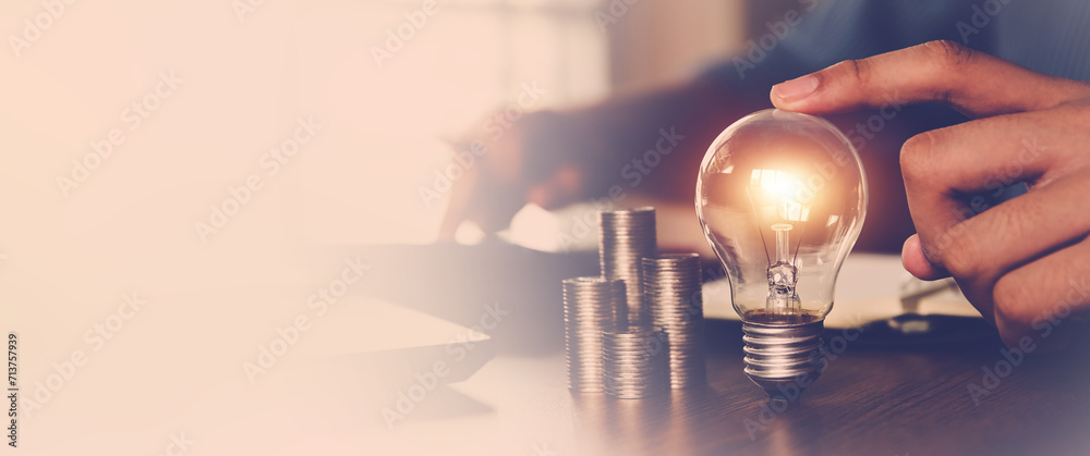 Hand choose light bulb with bright for creative idea concept or innovation of technology in analyzing global marketing online business data management services to target growth concept. - obrazy, fototapety, plakaty 