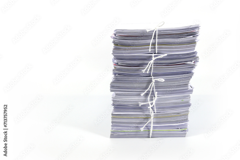 Pile or heap of paper financial business document paperwork stack on office desk concept of workload overtime or workplace paperless report copy on white background.