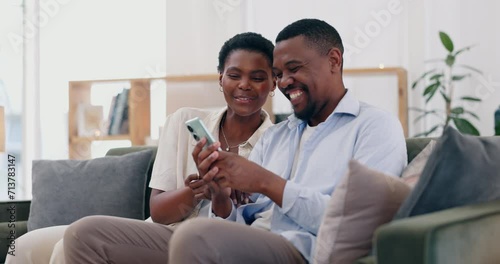 Happy, phone and black couple relax on sofa for bonding, relationship and online in home. Love, marriage and African man and woman on smartphone for social media, internet and website in living room photo