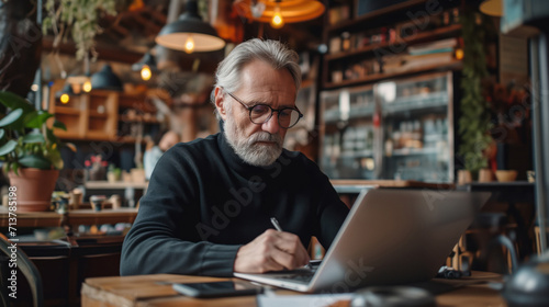Senior Entrepreneur Focused on Work in a Cozy Cafe Setting. AI Generative