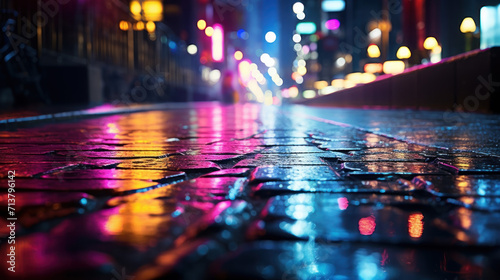 Rain-soaked Sidewalk Reflecting Neon City Lights at Night.
