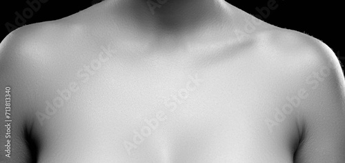 Female body part, breast and neck, cleavage. Monochrome photo