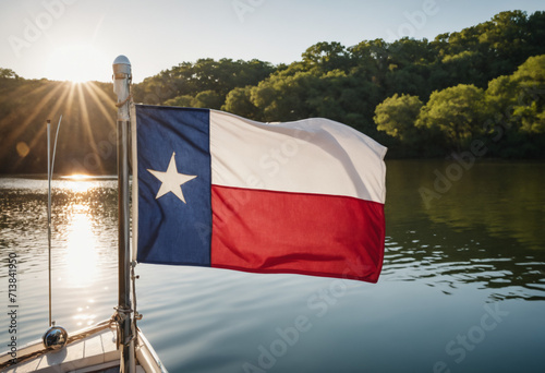 Texas flag flying from transom of boat on Ladybird Lake in Austin Texas photo