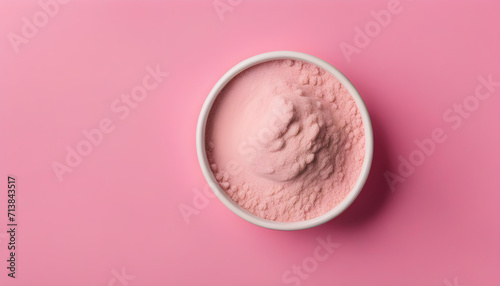 Pink powder brush on a pink background