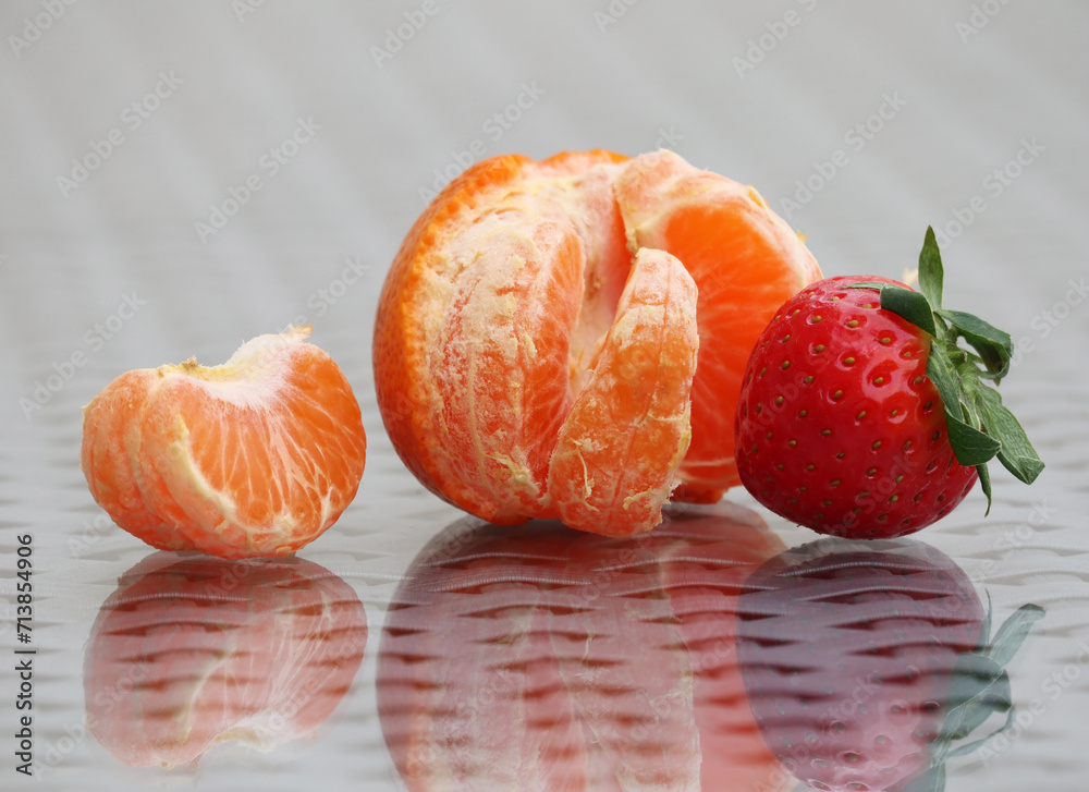 Ripe strawberry and tangerine Ripe strawberry and tangerine