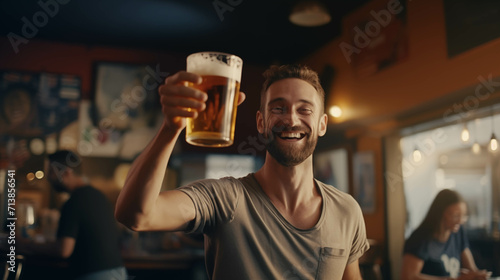 Caucasian man drinking beer in pub. photo