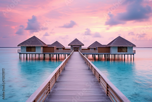 Water bungalows and wooden jetty on Maldives © Natalia Klenova