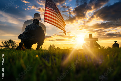 Tableau sur toile American soldiers pay their respects to fallen soldiers in front of the USA flag on Memorial Day or other events