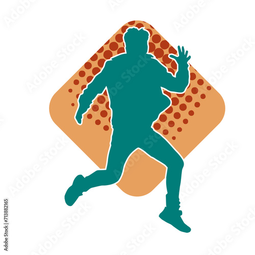 Silhouette of a slim man dancing pose. Silhouette of a male dancer in action pose.