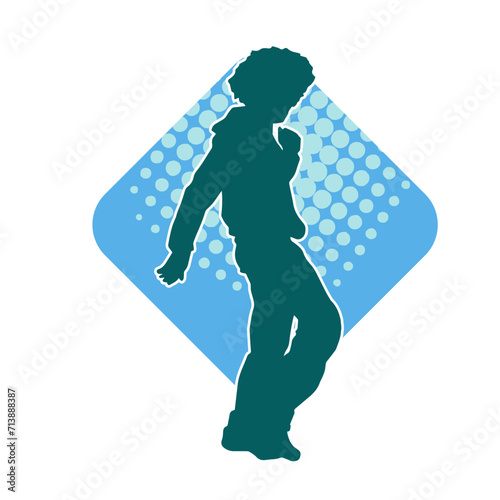 Silhouette of a slim man dancing pose. Silhouette of a male dancer in action pose.