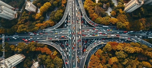 Aerial view of busy expressway with road traffic in megalopolis, highlighting vital infrastructure.
