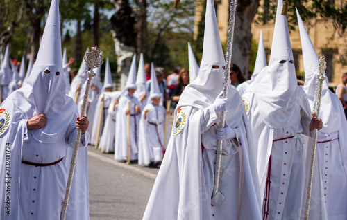 the penitents dressed in white ready for the long procession towards the center of the city