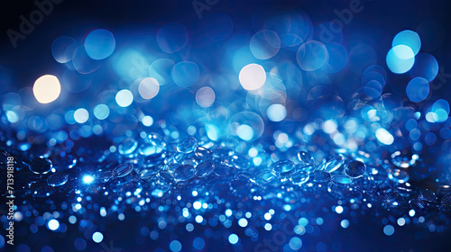 Blue bokeh background, raining light, blurry lights, blurry background, blue confettis on a black background, underwater, night lights, city lights, haze, depth of field, round bokeh, circle bokeh