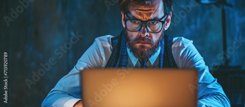 Experienced entrepreneur confused with financial news doubting while reading information from networks Skeptic businessman in eyeglasses angry about problems with project checking reports on la