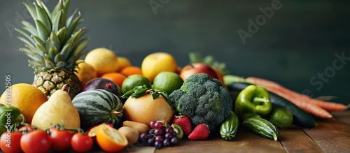 Female nutritionist with board with fresh fruits and vegetables in her office. Creative Banner. Copyspace image photo