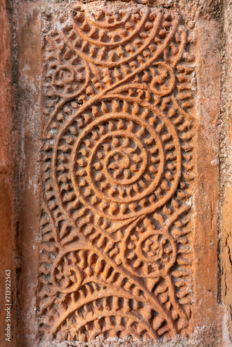 Closeup view of terracotta floral and geometric design on exterior wall of ancient Chachra Shiva temple aka Shiv mandir, Jessore, Bangladesh 