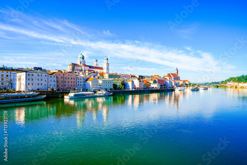 View of some buildings and the surrounding landscape by the river in the city of Passau. 