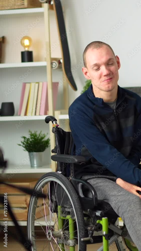 portrait of a happy disabled man in wheelchair at home portrait of a happy disabled man in wheelchair at home