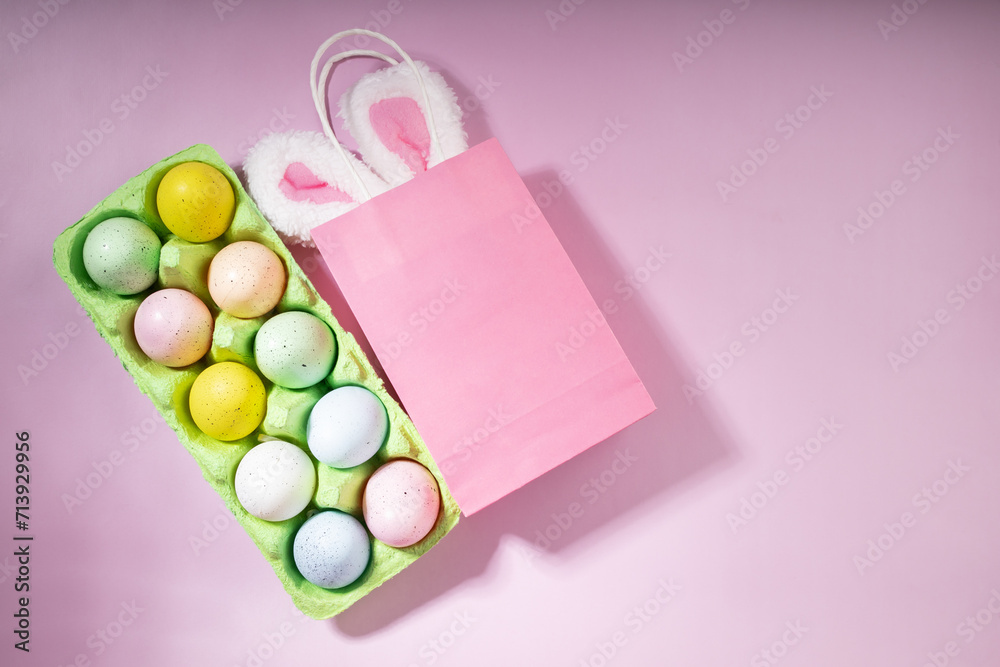 Easter celebration, bunny ears in a shopping bag, pastel background, eggs for sale Easter celebration, bunny ears in a shopping bag, pastel background, eggs for sale