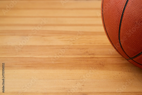 Basketball ball close-up on a wooden floor. Sports background, basketball background photo