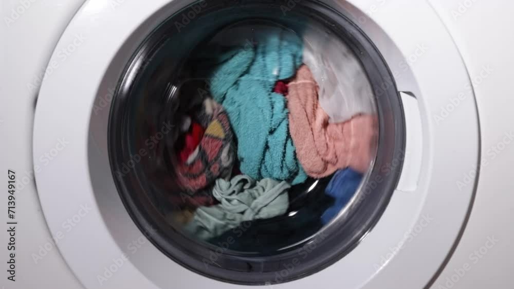 Laundry, clothes are washed in the drum of a washing machine Laundry, clothes are washed in the drum of a washing machine