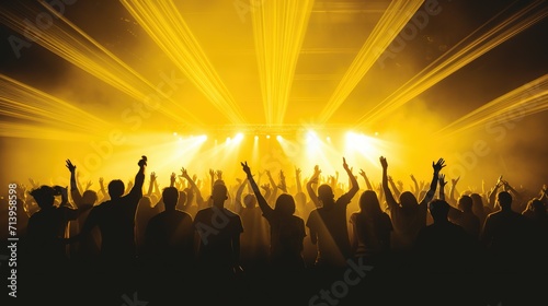 The crowded church worship rally with distance silhouette figure of the televangelist on stage light