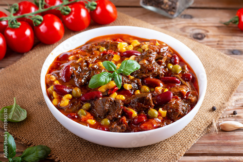 Homemade recipe for stew with red beans in hot chili sauce, mexican dish chili con carne soup. Goulash
