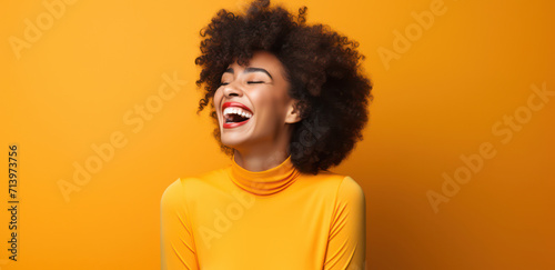Happy African Female: Youthful Joy and Beauty in a Stylish Afro Portrait © VICHIZH