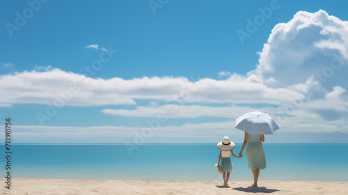 Back view of young mother and her little daughter are looking at seascape at sunset, summer vacation concept © AspctStyle
