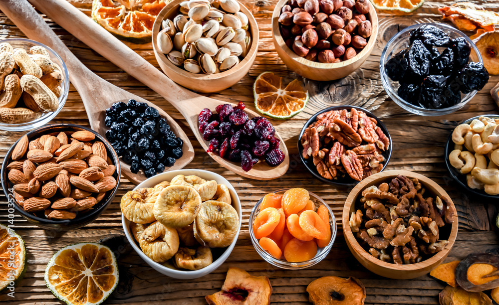 Composition with a variety of dried fruits and assorted nuts.