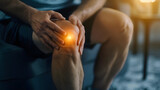 Young man with knee pain at home with highlighted knee, sport injuries health concept