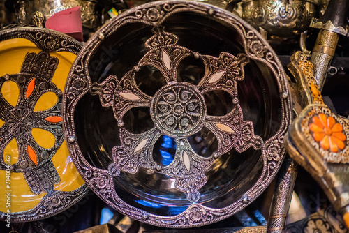 Marrakech, Morocco - March 28, 2022: All kinds of souvenirs exhibited in a shop in the ancient district of Medina in Marrakech. photo