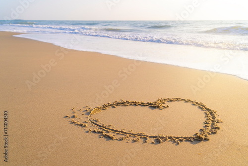 drawing a heart shape on the sand in the morning. love and emotions To welcome the Valentine s Day festival