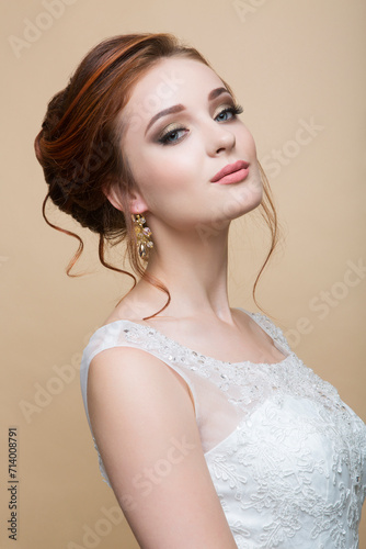 Young pretty caucasian bride in wedding dress