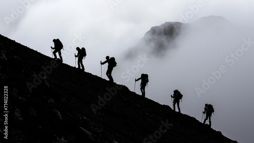 group of people walking in the mountains