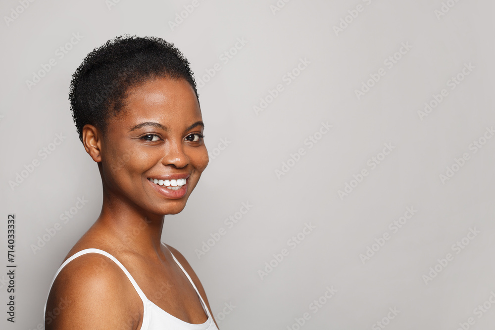 Glorious smiling woman with healthy fresh clean skin on white background. Facial treatment, skin care and cosmetology concept
