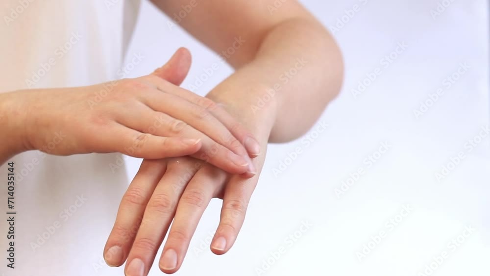 Moisturizing cream for skin. Anti-aging cosmetics. Feminine hand care. Woman applying hand cream, close-up. Apply hand cream to the skin using massage movements Moisturizing cream for skin. Anti-aging cosmetics. Feminine hand care. Woman applying hand cream, close-up. Apply hand cream to the skin using massage movements