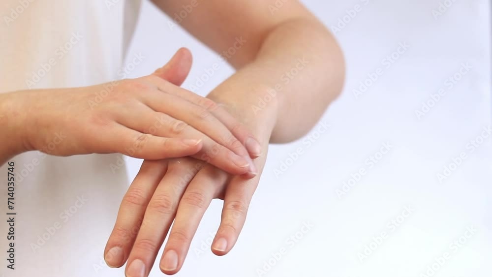 Moisturizing cream for skin. Anti-aging cosmetics. Feminine hand care. Woman applying hand cream, close-up. Apply hand cream to the skin using massage movements Moisturizing cream for skin. Anti-aging cosmetics. Feminine hand care. Woman applying hand cream, close-up. Apply hand cream to the skin using massage movements