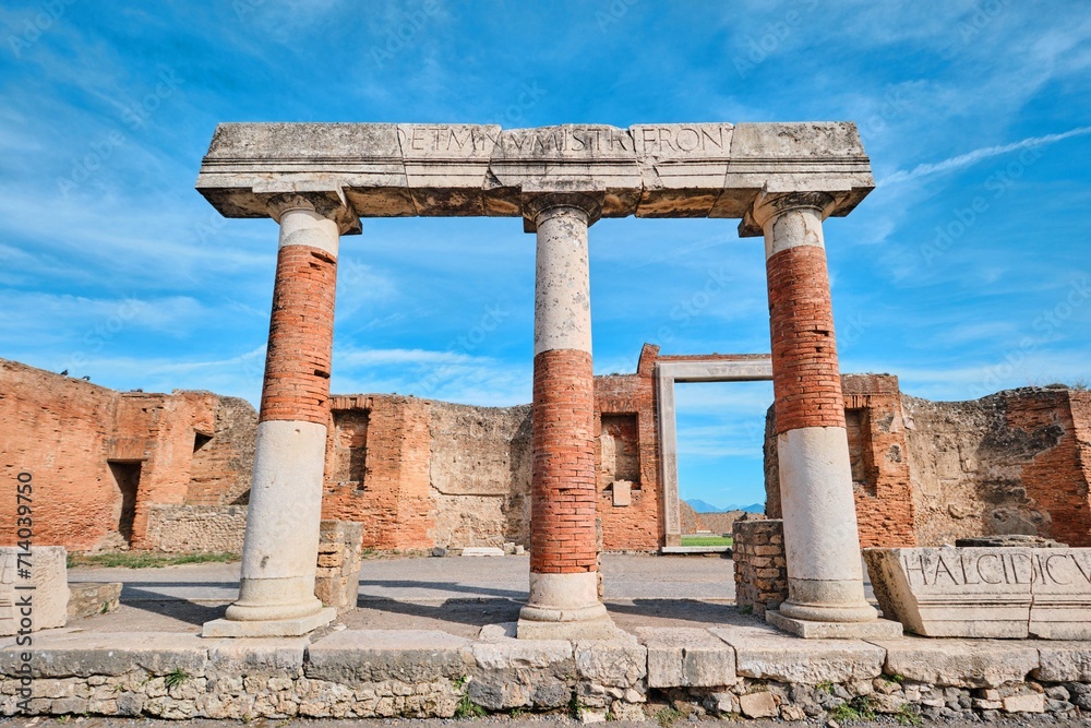 Stone and brick columns of Forum in the Ancient Roman city Pompeii, Naples, Italy