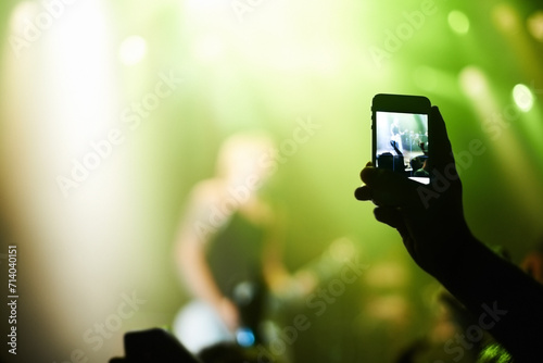 Nightclub  festival and audience with phone or lights for music  party and rave concert with silhouette and band. Disco  psychedelic event and performance with entertainment  crowd and smartphone