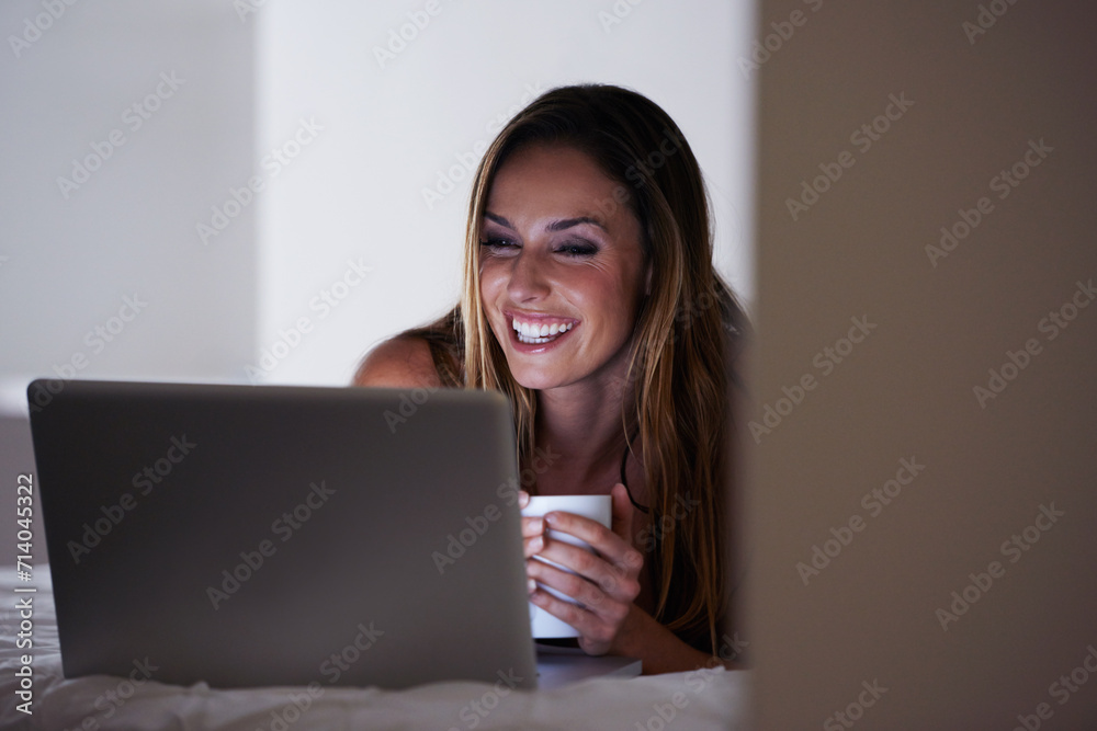 Happy woman, laptop and coffee on bed in morning for online entertainment or streaming at home. Young female person smile with beverage, latte or tea in relax on computer for social media in bedroom Happy woman, laptop and coffee on bed in morning for online entertainment or streaming at home. Young female person smile with beverage, latte or tea in relax on computer for social media in bedroom