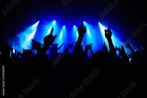Club, music and audience with hands and lights for party, concert or rave festival with spotlight and dancing. Disco, psychedelic event and performance with entertainment, crowd and mock up space